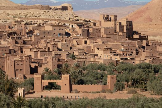 Ait Ben Haddou ksar Morocco, ancient fortress that is a Unesco Heritage site. Beautiful late afternoon light with honey, gold coloured mud brick construction the kasbah, or fortified town dates from 11th cent. and is on the former caravan route from the Sahara and Marrakech. The location has been used for many famous movies. High quality photo