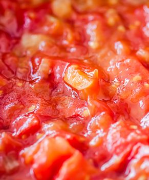 Cooking tomato sauce, closeup steamed vegetables for cook book or food blog backgrounds