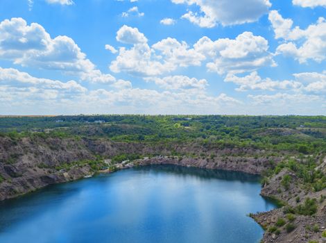 Migia radon radioactive lake. Abandoned granite quarry in Mykolaiv region, Ukraine. Stock photography.