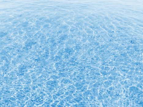 Blue water texture with small waves in sunny day. Stock photography.