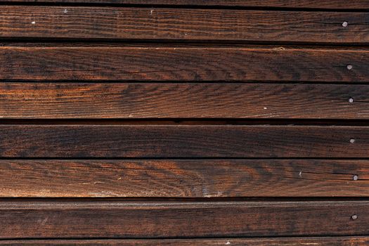 Old brown natural rustic wood background with vertical wooden boards. Space for text.