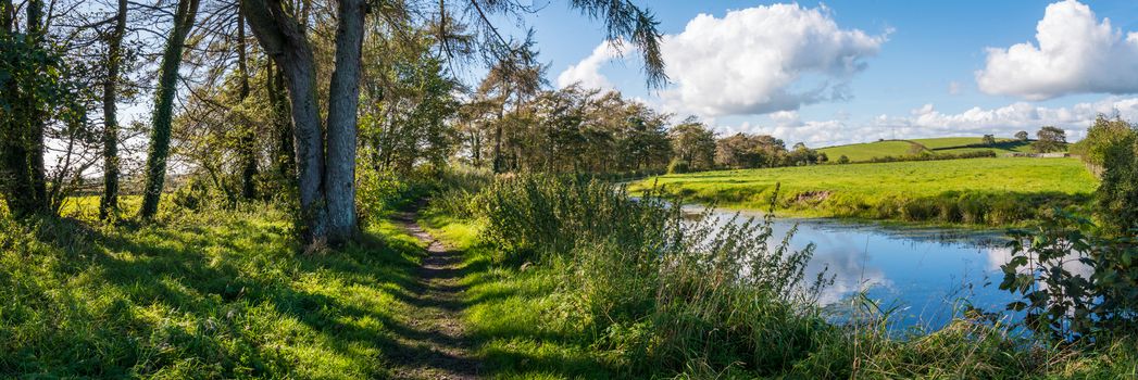 View of an English rural countryside scenery on British waterway