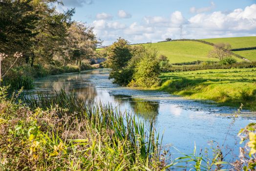 View of an English rural countryside scenery on British waterway