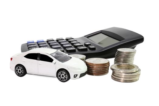 Coins stack with Calculator and car , concept Saving money for car or trade car for cash
