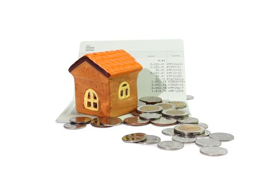 Model house with coin, calculator, book bank, concept Collecting money Buying a house, residence, business, finance