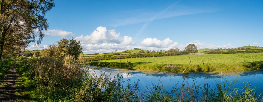 View of an English rural countryside scenery on British waterway