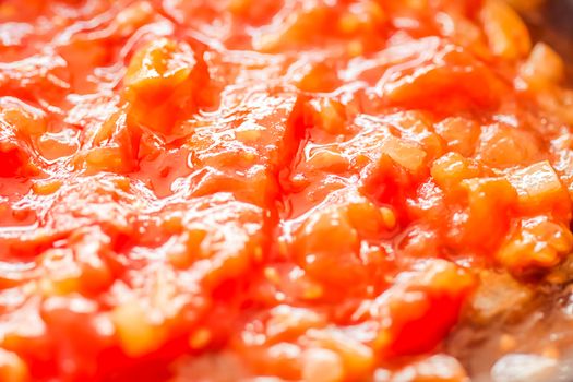 Cooking tomato sauce, closeup steamed vegetables for cook book or food blog backgrounds