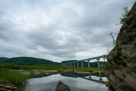 The Norman Wood Bridge Over the Susquehanna River in Holtwood Pennsylvania Casting a Reflection Into the Water