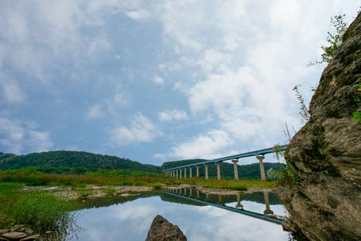 The Norman Wood Bridge Over the Susquehanna River in Holtwood Pennsylvania Casting a Reflection Into the Water