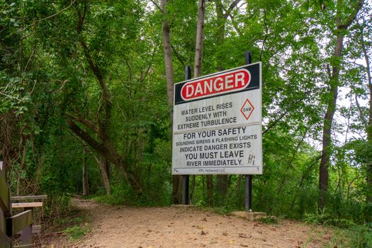 HOLTWOOD, PENNSYLVANIA - SEPTEMBER 9, 2020: A Sign Warns of Flashing Lights and Sirens Being an Indicator of a Siden Rise in Water Level. Located near the Historic Lock 12.