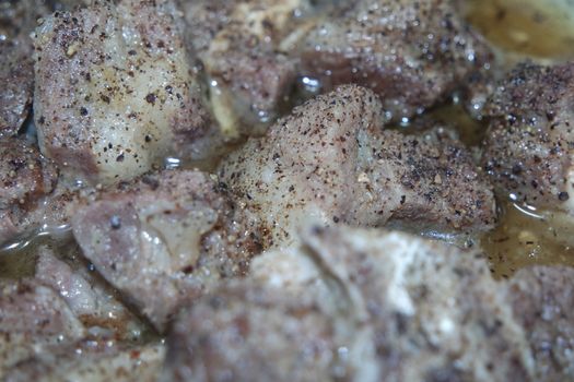 Top view of siri paaye or paya dish garnished with diced ginger, long coriander and black pepper. This dish is popular in Pakistan and Bangladesh