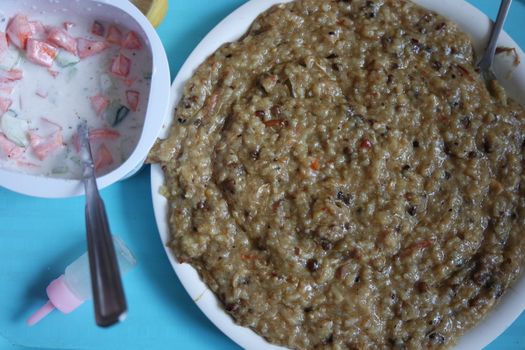 A close up view of Cooked white rice called Kichra served with green mint with traditional Charsadda recipe popular for its delicious taste in Pakistan