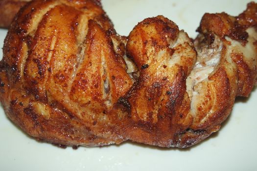 Fried, grilled baked chicken pieces with marinated spices on it. Tasty delicious fried chicken barbecue