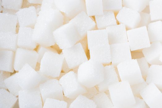 Sugar cube texture background sweet food ingredient, studio shot health high blood risk of diabetes, and calorie intake concept