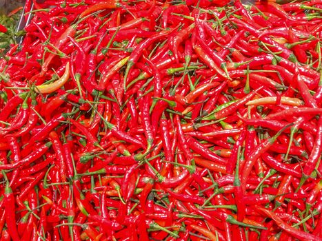 Closeup a pile of fresh chilli in a supermarket.