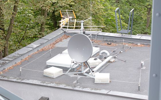 Small white satellite antenna on the roof