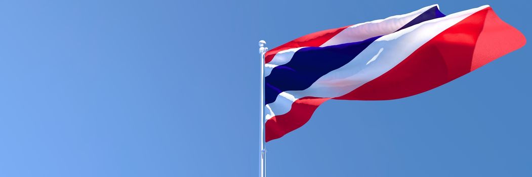 3D rendering of the national flag of Thailand waving in the wind against a blue sky