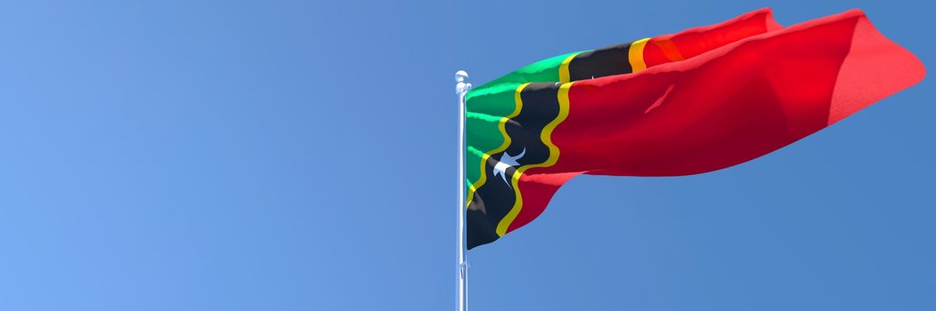 3D rendering of the national flag of Saint Kitts and Nevis waving in the wind against a blue sky