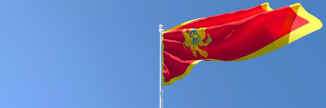 3D rendering of the national flag of Montenegro waving in the wind against a blue sky