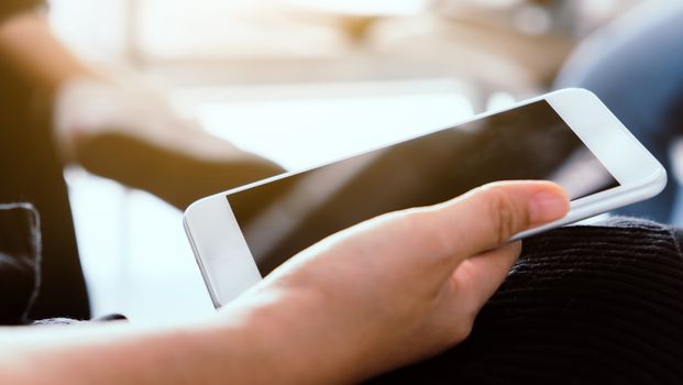 Closeup Image of Women Hand holding a smartphone