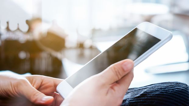 Closeup Image of Women Hand holding a smartphone
