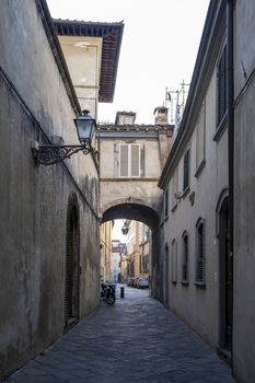 old narrow alley in tuscan village. antique italian lane in Montalcino, Tuscany, Italy