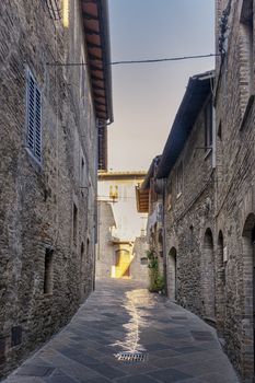 old narrow alley in tuscan village. antique italian lane in Montalcino, Tuscany, Italy