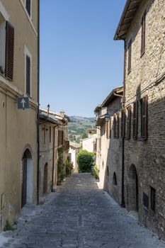 old narrow alley in tuscan village. antique italian lane in Montalcino, Tuscany, Italy