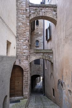 old narrow alley in tuscan village. antique italian lane in Montalcino, Tuscany, Italy