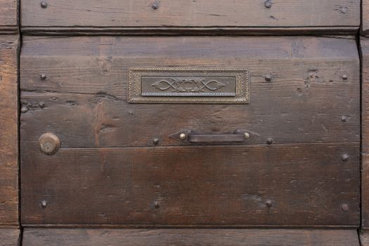 old ornate wooden door with beautiful carvings in italy