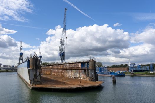 Floating dry dock with cranes in the port of rotterdam, the Netherlands