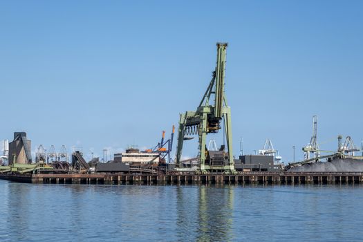 Netherlands, Rotterdam. Coal terminal wih big industrial cranes for handling coal transportation on the Maasvlakte in the port of Rotterdam