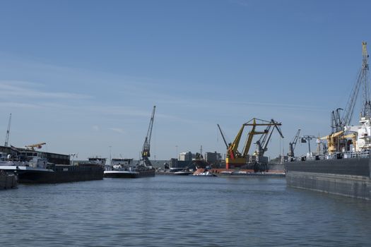 ROTTERDAM Container ships moored at a container terminal in the Port of Rotterdam. The port is the Europ's largest and facilitate the needs of a hinterland with 40,000,000 consumers