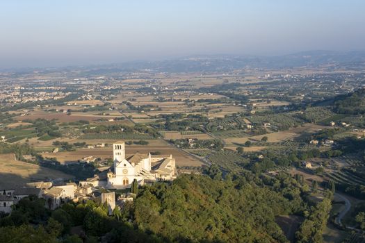 View of Assisi and the old church in the early morning, Umbria, Italy