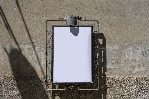 Empty menu board stand and outdoor cafe in italy