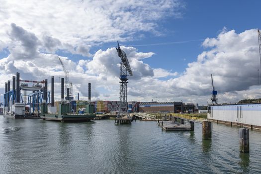 ROTTERDAM Container ships moored at a container terminal in the Port of Rotterdam. The port is the Europ's largest and facilitate the needs of a hinterland with 40,000,000 consumers