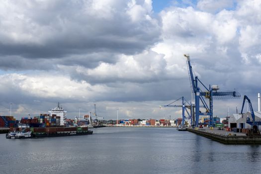 ROTTERDAM Container ships moored at a container terminal in the Port of Rotterdam. The port is the Europ's largest and facilitate the needs of a hinterland with 40,000,000 consumers