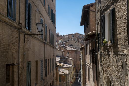 typical Italian street in a small provincial town of Tuscan, Italy, Europe.