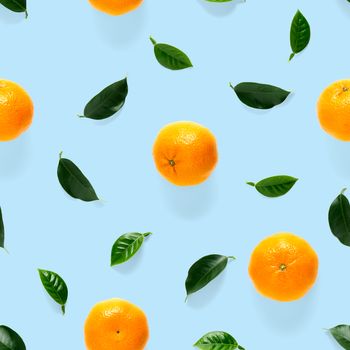 Mandarin seamless pattern, tangerine, clementine isolated on blue background with green leaves. Collection of fine Mandarine seamless patterns.