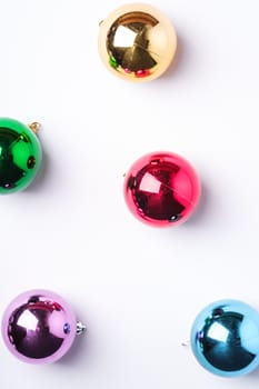 Christmas New Year composition. Gifts, colorful ball decorations on white background. Winter holidays concept. Flat lay, top view