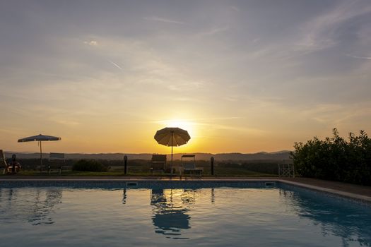 Outdoors Spa swimmingpool. Tropical resort hotel at sunset