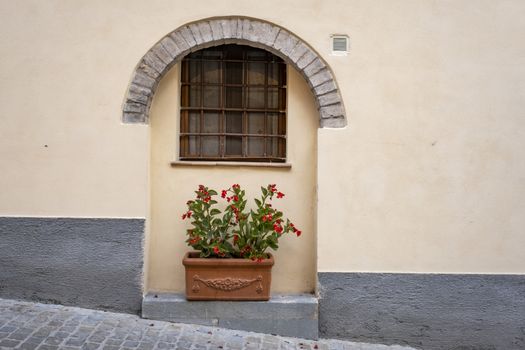 Spello, Perugia, Umbria, Italy. Typical alley with potted plants and flowers.