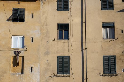 Facade of a Old Building with Windows in a Medieval Town of Tuscany, Italy