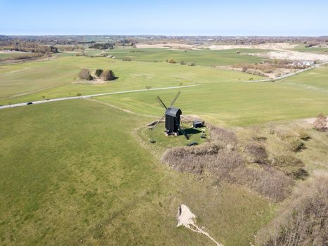 Hoejerg, Denmark - April 23, 2019: Aerial view of the historic Danish windmill called Pibe Moelle.