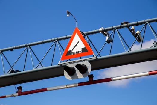 Warning road sign for drawbridge mounted on a steel girder.
