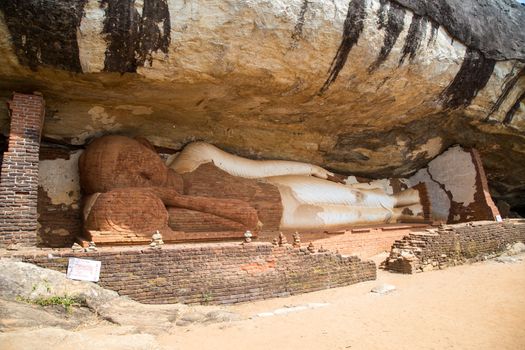 Sigiriya, Sri Lanka - August 17, 2018: A reclining buddha statue at Piduranagala Rock