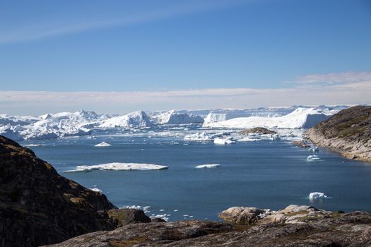 Ilulissat, Greenland - June 30, 2018: The Ilulissat Icefjord seen from the viewpoint. Ilulissat Icefjord was declared a UNESCO World Heritage Site in 2004.