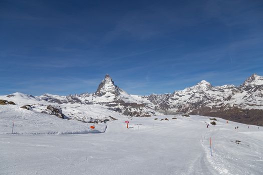 Zermatt, Switzerland - April 12, 2017: Empty ski piste in front of the famous Matterhorn