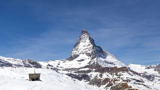 The famous mountain Matterhorn and a small chapel close to Zermatt, Switzerland