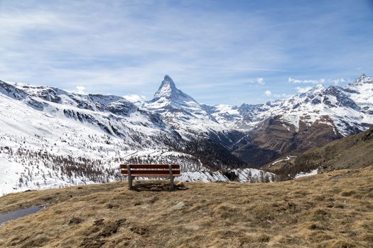 A bench with view of the Swiss Alps with the famous Matterhorn.